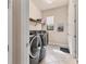 Laundry room with side-by-side washer and dryer, storage shelving and ample space at 3519 Founders Club Dr, Sarasota, FL 34240
