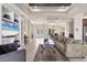Bright living room with dining area, tile floors, and stylish furnishings at 3519 Founders Club Dr, Sarasota, FL 34240
