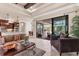 Elegant living room featuring a sliding glass doors and seamless indoor/outdoor flow at 3519 Founders Club Dr, Sarasota, FL 34240