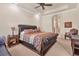 This main bedroom offers carpeted floors, ample natural light, a leather bed frame and sitting area at 3519 Founders Club Dr, Sarasota, FL 34240