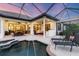Spacious lanai with a pool, spa, and an outdoor dining area, perfect for entertaining at 3519 Founders Club Dr, Sarasota, FL 34240