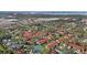Aerial view of a residential neighborhood with manicured lawns and mature trees surrounding the homes at 3740 Pinecone Ct # 163, Sarasota, FL 34238