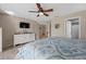 Well-lit bedroom featuring a coastal-themed bedspread and a ceiling fan at 3740 Pinecone Ct # 163, Sarasota, FL 34238