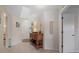 Inviting entryway with tile floors, a decorative table, and a 'welcome' sign on the wall at 3740 Pinecone Ct # 163, Sarasota, FL 34238