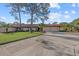 Attractive home with a well-manicured lawn, a driveway, and mature trees at 3740 Pinecone Ct # 163, Sarasota, FL 34238