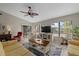 Comfortable living room with large windows and cozy furniture at 3740 Pinecone Ct # 163, Sarasota, FL 34238