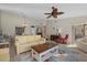 Comfortable living space with stylish furniture, a ceiling fan, and an open layout at 3740 Pinecone Ct # 163, Sarasota, FL 34238