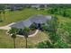 Beautiful aerial view of the property with lush landscaping and a serene pond in the backyard at 4412 Wolf Ridge Xing, Parrish, FL 34219