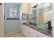 Stylish bathroom featuring vessel sinks, a granite countertop, and a walk-in shower at 4412 Wolf Ridge Xing, Parrish, FL 34219