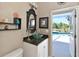 Powder room featuring a vessel sink and access to the outdoor pool area at 4412 Wolf Ridge Xing, Parrish, FL 34219