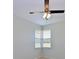 An empty, neutrally decorated bedroom featuring a ceiling fan and lots of light from the window at 4412 Wolf Ridge Xing, Parrish, FL 34219