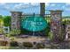 Charming FoxBrook community sign with stone pillars and landscaping enhancing curb appeal at 4412 Wolf Ridge Xing, Parrish, FL 34219