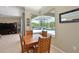 Cozy dining area with views of the screened-in pool and backyard at 4412 Wolf Ridge Xing, Parrish, FL 34219