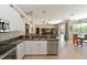 Beautiful kitchen featuring stainless steel appliances and granite countertops in an open layout at 4412 Wolf Ridge Xing, Parrish, FL 34219