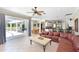 Expansive living room with leather furniture and an open floor plan at 4412 Wolf Ridge Xing, Parrish, FL 34219