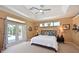 Spacious primary bedroom with access to the outdoor pool area at 4412 Wolf Ridge Xing, Parrish, FL 34219