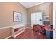 Cozy office space with wood floors, a built-in desk, and ample natural light at 4412 Wolf Ridge Xing, Parrish, FL 34219