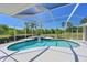 Relaxing screened-in pool and spa with tile trim, perfect for outdoor enjoyment and entertaining at 4412 Wolf Ridge Xing, Parrish, FL 34219
