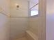 An elegant, tiled shower room featuring glass door and shower head at 4412 Wolf Ridge Xing, Parrish, FL 34219