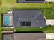 An aerial view shows a home with a screened pool and solar panels at 4509 95Th E Ter, Parrish, FL 34219