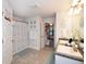Bright bathroom with shower and dual sinks on granite countertops; great space at 4509 95Th E Ter, Parrish, FL 34219