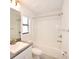 Bathroom with tub-shower combination, white cabinets, and granite countertop at 4509 95Th E Ter, Parrish, FL 34219