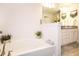 Bathroom featuring a soaking tub, granite counter and a linen closet at 4509 95Th E Ter, Parrish, FL 34219