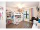 Bright bedroom features a bunk bed and a window bringing in lots of natural light at 4509 95Th E Ter, Parrish, FL 34219