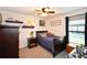 Bedroom with a ceiling fan, carpet and decor shelves above the single bed at 4509 95Th E Ter, Parrish, FL 34219