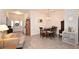 Inviting open-concept dining area features decorative lighting and seating for four at 4509 95Th E Ter, Parrish, FL 34219