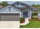 Charming home with a well-manicured lawn, inviting entry and a two car garage at 4509 95Th E Ter, Parrish, FL 34219