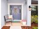 Inviting front porch features a cozy bench, plants and wreath, welcoming guests at 4509 95Th E Ter, Parrish, FL 34219