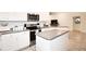 Kitchen features granite countertops, stainless steel appliances, a breakfast bar and tile floors at 4509 95Th E Ter, Parrish, FL 34219