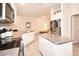 Bright kitchen features granite countertops, white cabinetry, stainless appliances, and a large island at 4509 95Th E Ter, Parrish, FL 34219