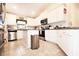 Bright kitchen featuring stainless steel appliances, granite countertops, and ample cabinet space at 4509 95Th E Ter, Parrish, FL 34219