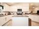 Bright and open kitchen featuring granite countertops, stainless steel appliances, and an island at 4509 95Th E Ter, Parrish, FL 34219