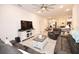 Comfortable living room includes tile flooring, neutral walls, ceiling fan and TV area at 4509 95Th E Ter, Parrish, FL 34219