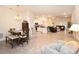 Bright, open-concept living space with dining area, island kitchen and comfortable seating, perfect for modern living at 4509 95Th E Ter, Parrish, FL 34219