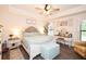 Serene main bedroom boasts tray ceiling, neutral paint, and vanity with great natural light at 4509 95Th E Ter, Parrish, FL 34219