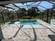 A gorgeous screened pool with water features and pavers, perfect for backyard enjoyment at 4509 95Th E Ter, Parrish, FL 34219