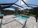 The stunning screened pool with water features is surrounded by pavers and lots of space at 4509 95Th E Ter, Parrish, FL 34219