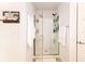 Shower with glass door and tiled surround offers a bright and clean space at 4509 95Th E Ter, Parrish, FL 34219