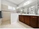 Bathroom featuring double vanity, enclosed shower and natural light at 4578 Cedar Brush Ter, Sarasota, FL 34243