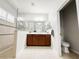 Bathroom with neutral tile and enclosed toilet at 4578 Cedar Brush Ter, Sarasota, FL 34243