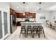 Modern kitchen with stainless steel appliances, granite countertops, and a breakfast bar at 4578 Cedar Brush Ter, Sarasota, FL 34243