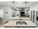Well-appointed kitchen with granite counters overlooking the open concept living space at 4578 Cedar Brush Ter, Sarasota, FL 34243