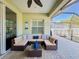 Outdoor seating area with comfortable furniture under a screened patio, ideal for entertaining at 4578 Cedar Brush Ter, Sarasota, FL 34243