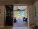 View from interior looking out to a screened patio and outdoor view at 4578 Cedar Brush Ter, Sarasota, FL 34243