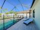 Enclosed pool with brick paver decking and lounge chairs perfect for enjoying sunny days at 4578 Cedar Brush Ter, Sarasota, FL 34243