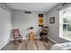 Cozy bedroom featuring two chairs and sports-themed decorations at 4673 Lummus St, North Port, FL 34286